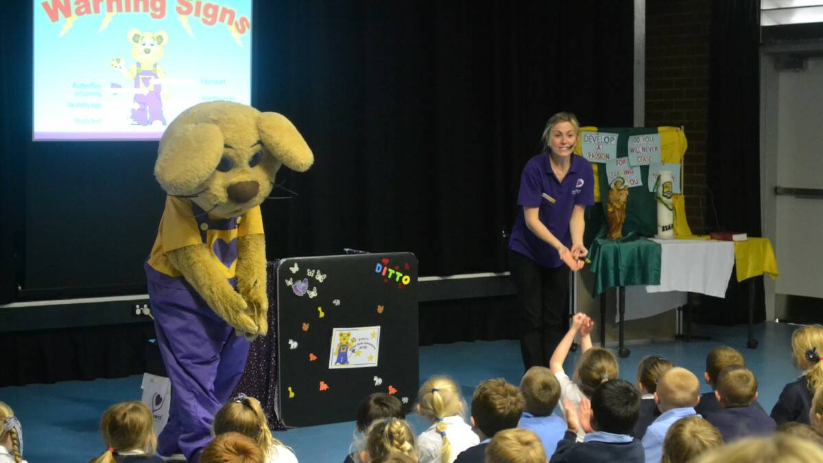 Ditto the Bravehearts Lion and friend educate local kids on the importance of personal safety.