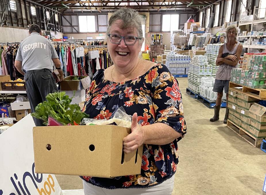 One of the happy recipients of the fresh produce boxes, generously donated by the Mid North Coast community. Photo supplied