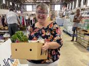 One of the happy recipients of the fresh produce boxes, generously donated by the Mid North Coast community. Photo supplied