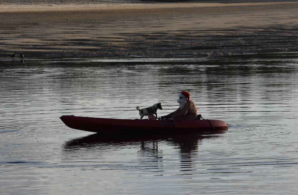 Ron Hunter said he will continue to spread the Christmas cheer from his kayak for as long as he can. Picture by Mardi Borg