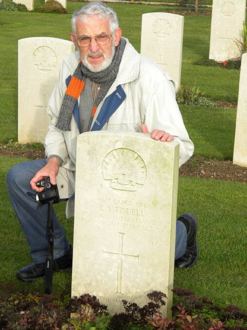 Peter C.McCarthy at the grave of Cpl. L.S. Tisdell in Villers Bretonneux, France on November 10, 2010.
