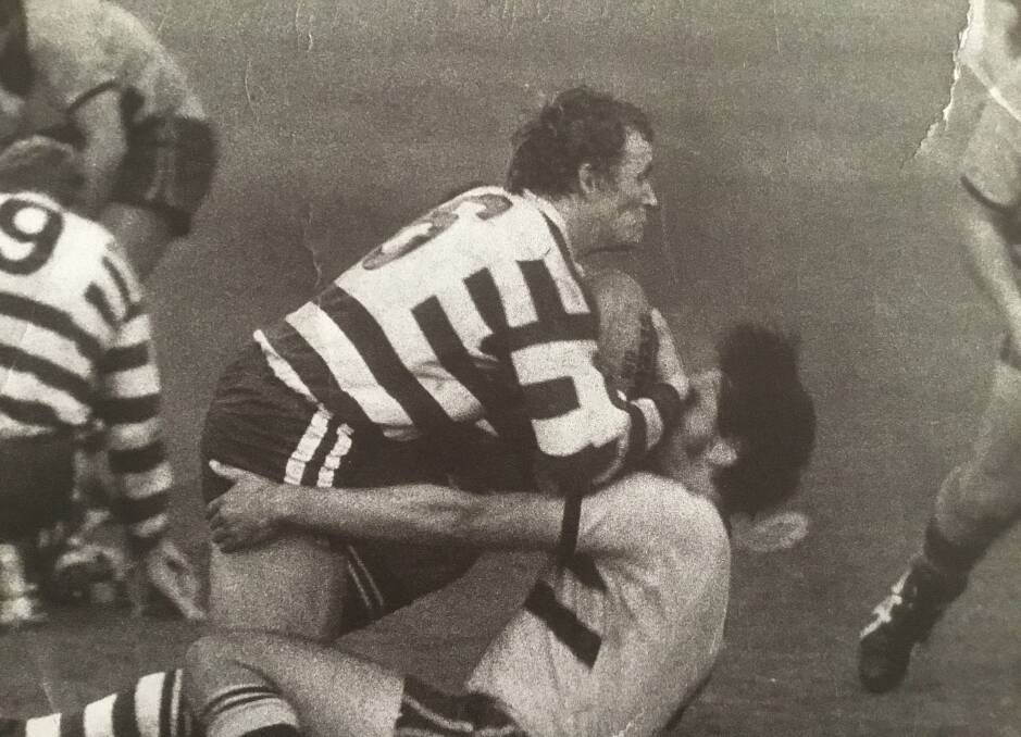 Phil Amidy tries to break a tackle during his stint in the Newcastle competition with Central Charlestown.