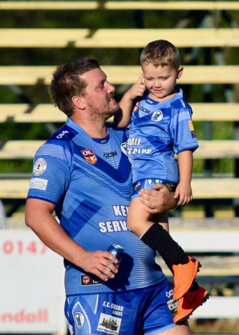 BLUE BLOOD: Blue's Anthony Conlan celebrates a victory on the field with his son Sam.