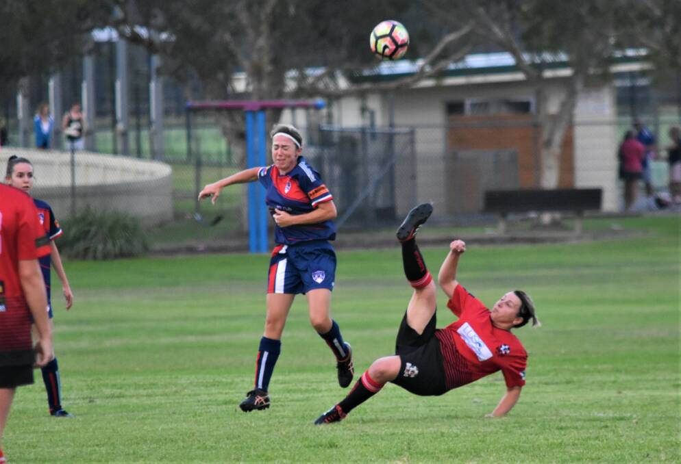 Spectacular: Camden Haven Redbacks' Maria Wilson attempting to clear the ball during their clash with Wauchope on the weekend. Photo: Luisa Papas