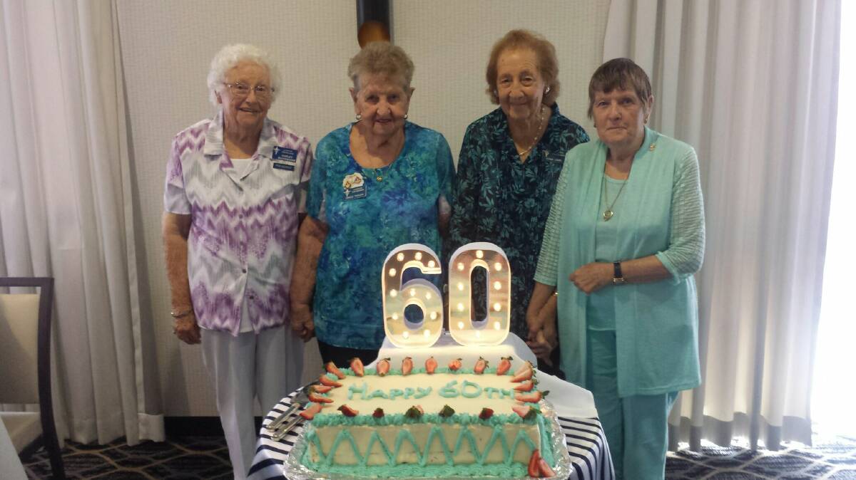 Happy birthday: Shirley Buckingham, Grace Taylor, Edna Lamb and Gloria Smith celebrating the 60th anniversary of the Torchbearers in Laurieton. The group raises money for Port Macquarie Hasting Legacy. 