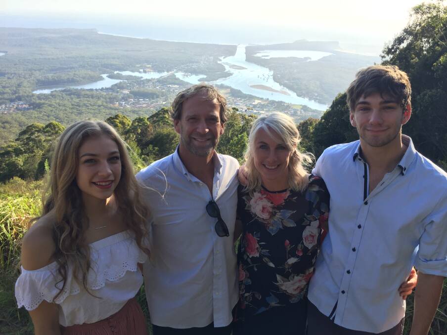 Welcome: Kate, Mike, Candace and Connor Foy soaking up the atmosphere at the Australia Day citizenship ceremony on North Brother Mountain on Saturday. 