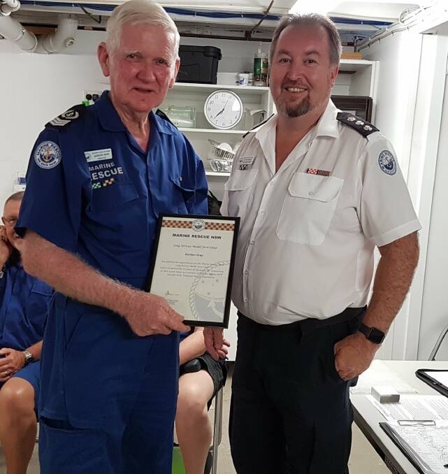 Well done: Regional operations manager Northern Rivers John Murray, right, presenting Gordon Gray his long service medal.