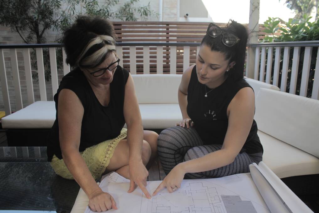 Planning: Little Learners Group co-owner, Jenny Grundy and daughter and early learning teacher, Jessica looking over plans for their new centre at Bonny Hills. Photo: supplied