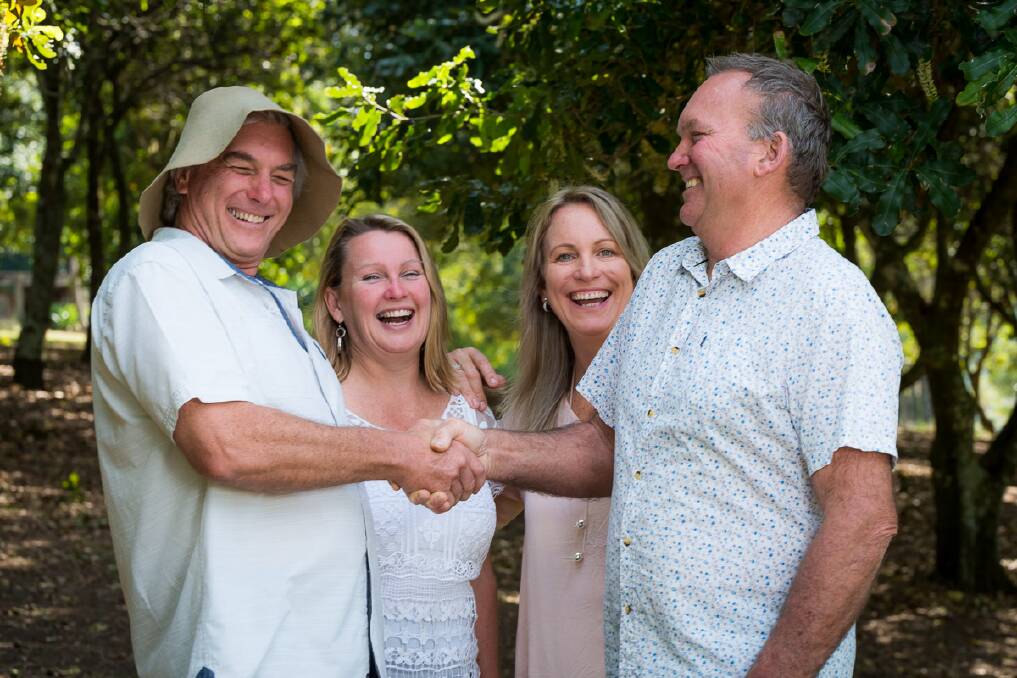 It's yours: Ray and Joanne Scott congratulating the new owners of the Lorne Macadamia Farm Angie Morley and John Bell.