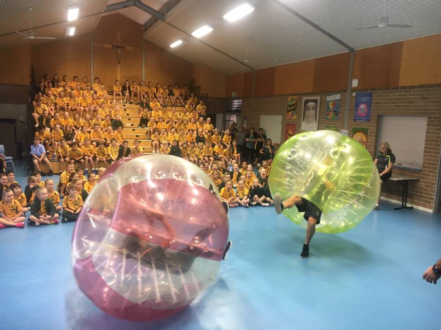 Too much fun: Inflatable soccer is just one of the attractions at this year's St Joseph's Primary School Fun Fair on Saturday November 4. Photo: supplied