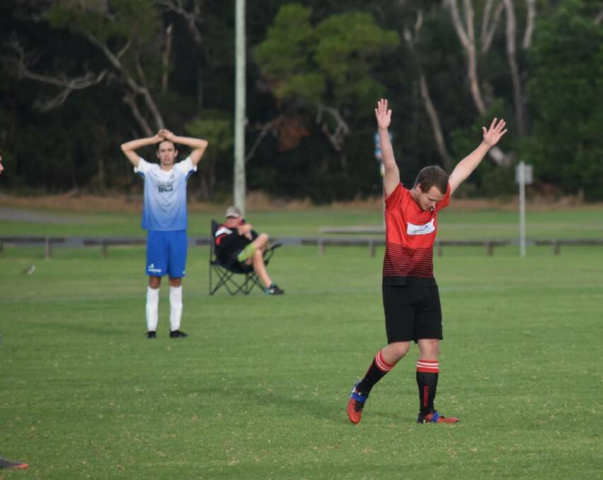You beauty: Shannon Ravoul shows his emotions after scoring the goal to cement the Redbacks a 4-3 win. A Taree Wildcats player looks deflated in the background.