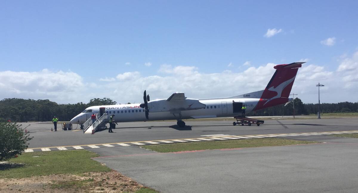 All aboard: The Qantas flight about to depart Port Macquarie on Wednesday November 18.