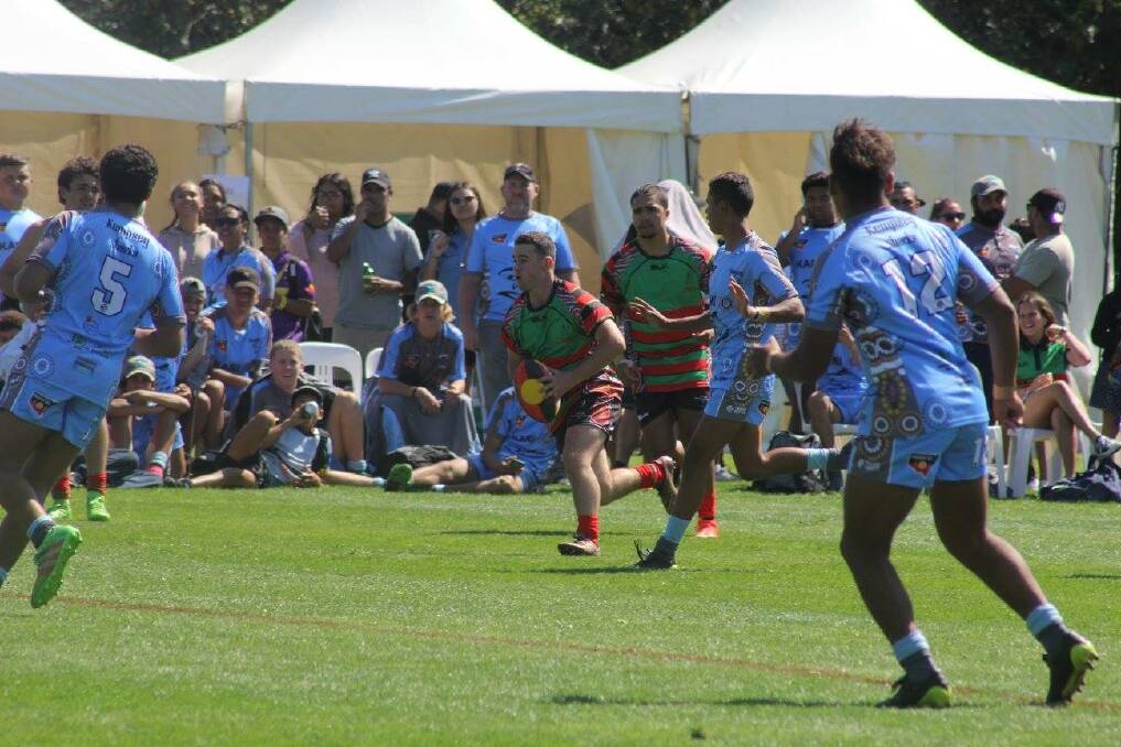 On the run: Jackson Brannigan taking on the defence in the Koori Knockout.