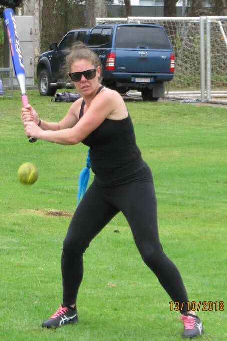 Ready to fire: Shanene Matthews warming up just before her run scoring hit. Photo: Jo-Anne Critchley