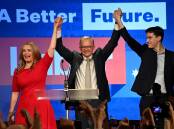 Anthony Albanese, centre, celebrates with his partner Jodie Haydon and son Nathan Albanese after after winning the 2022 federal election. Picture: AAP