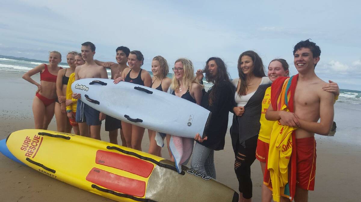 HELPING HAND: Bonnies surf lifesavers help young Rotary exchange visitors from all over the world to stay safe in the surf in Australia.