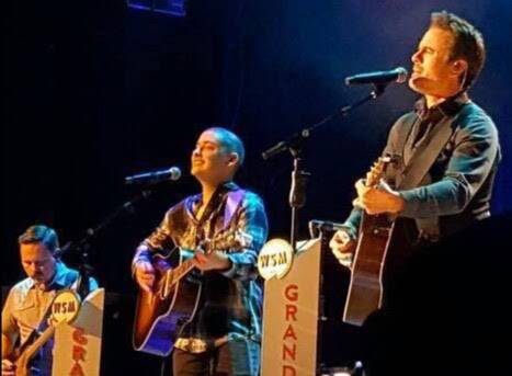 RISING STAR: Angus Gill (centre) on stage at the Nashville Grand Ole Opry with TV star Charles Esten and his band.