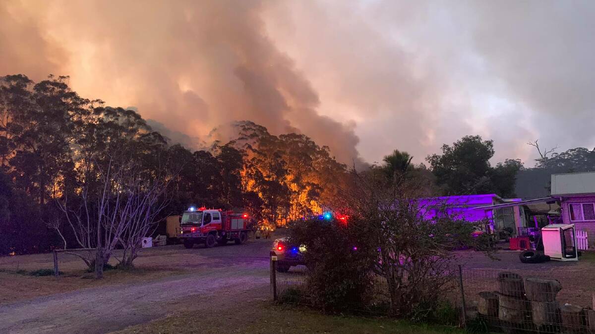 Firefighters at Lindfield Park Road in Port Macquarie last month. Photo courtesy of Sancrox/Thrumster Rural Fire Brigade.
