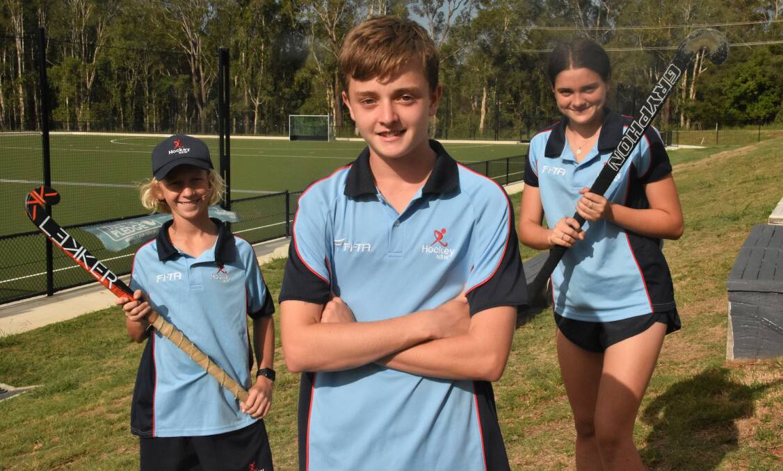 Bayden Smith, Luke Merrill and Maddie Drewitt have been selected in the NSW under-15 hockey teams. Photo: Paul Jobber