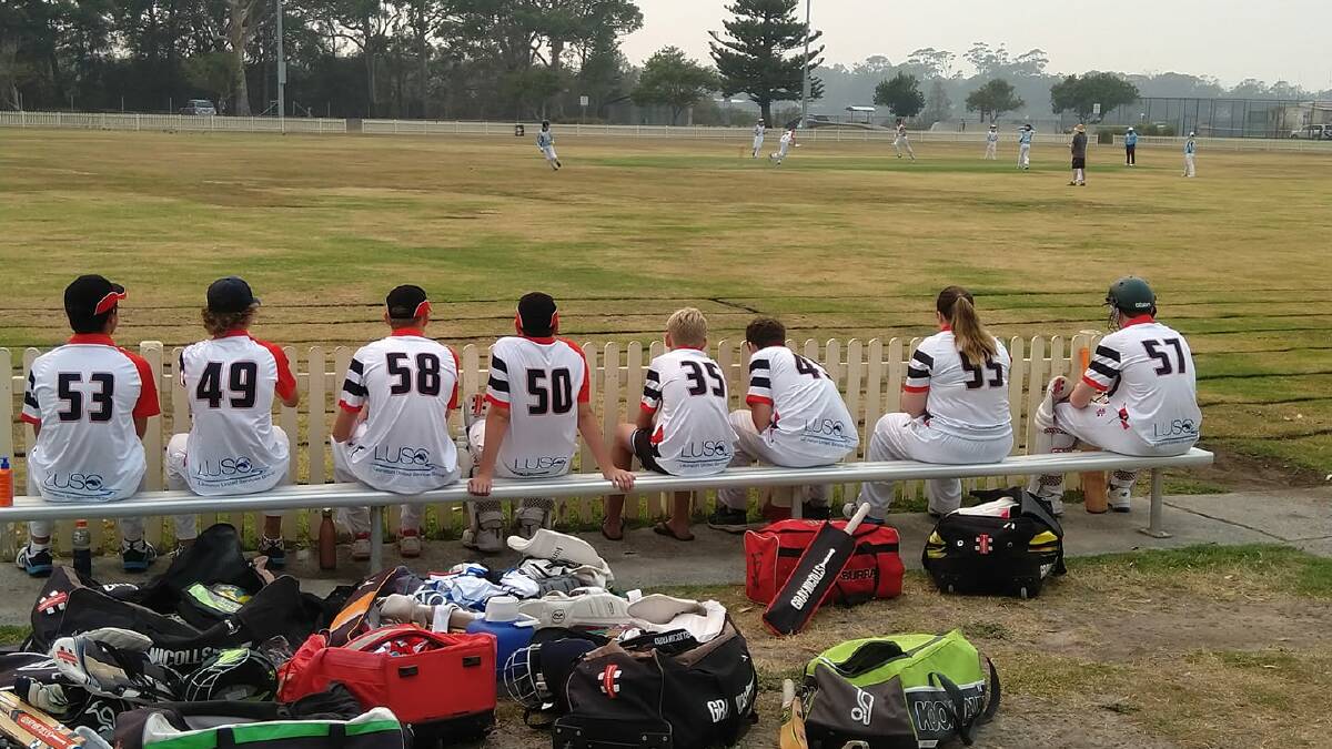 Back again: Camden Haven junior cricketers look on during last summer's bushfire crisis. Photo: Facebook