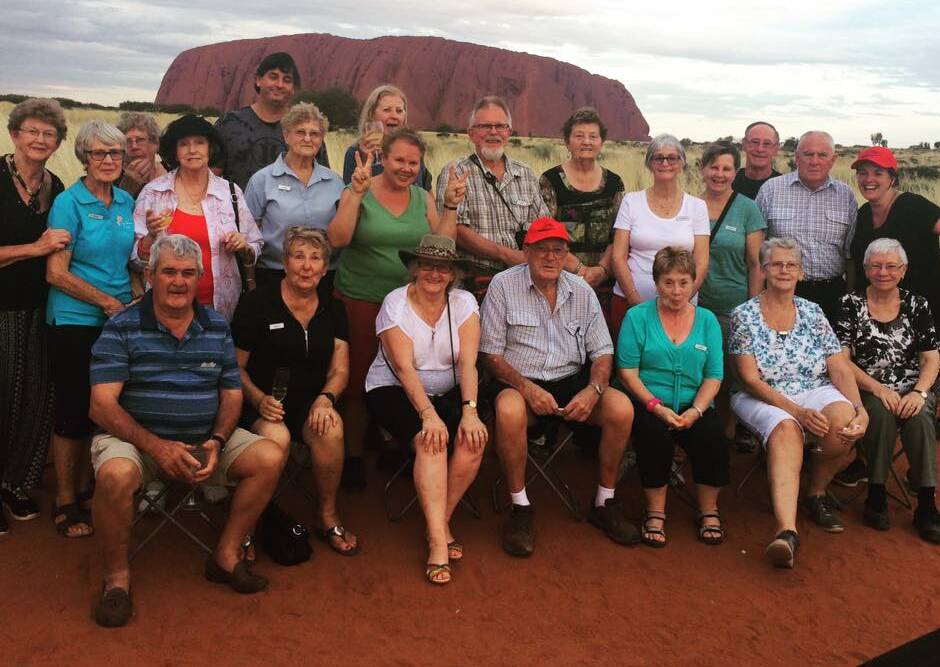 Group fun: There is no need to miss out on the joy of travel if you're single. The Itchy Feet Travel Club meets regularly in Laurieton with the friendly group of locals enjoying travelling together including a recent trip to Uluru.