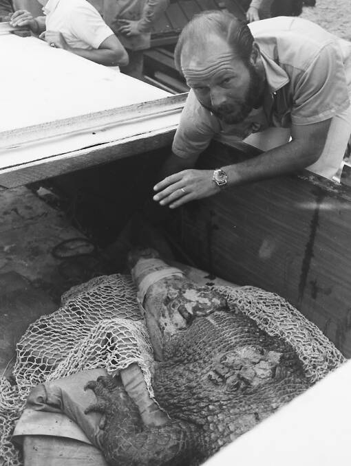 Cautious: Ken Underwood prepares to unload Big Mumma from her big trailer box after her trip from Townsville, 1969. Photos supplied.