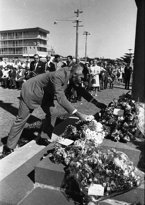 Lest we forget: RSL Sub-branch president, Dr Harry Hodgson places a wreath at the Port Macquarie War Memorial, 1971.