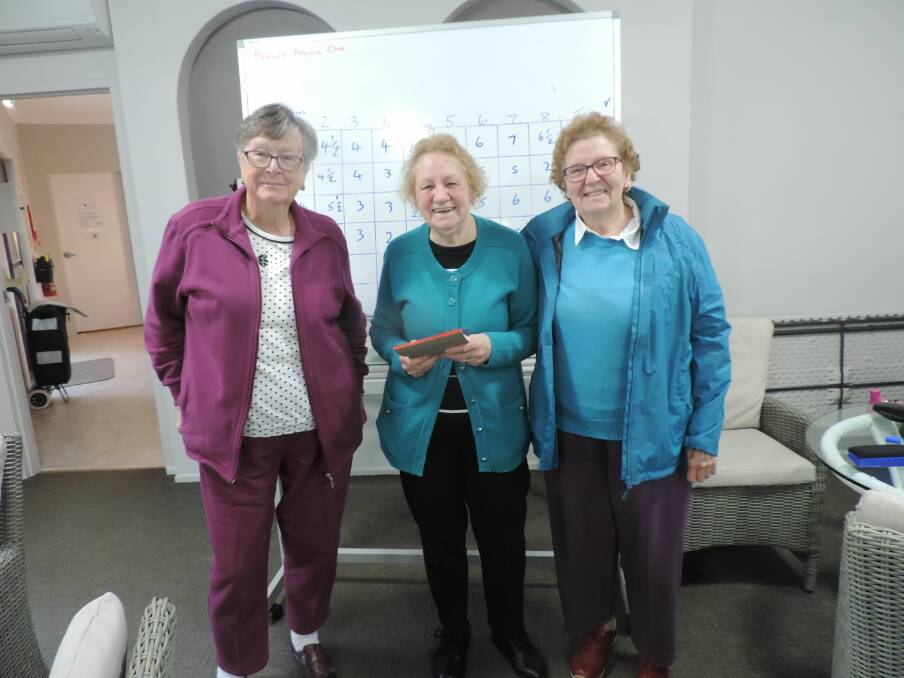 Active brains: Beryl Colless,Crystal Richards, and Maureen McLellan enjoy Queens Lake Village trivia afternoon last month.
