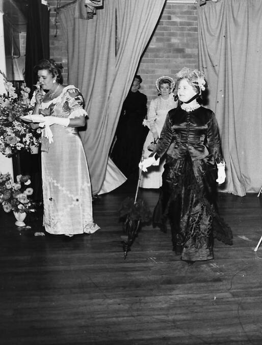 Best in show: Flower Show compere Jo Gott introduces Pearl Anderson wearing the winning period costume at the Church of England flower show, 1968.