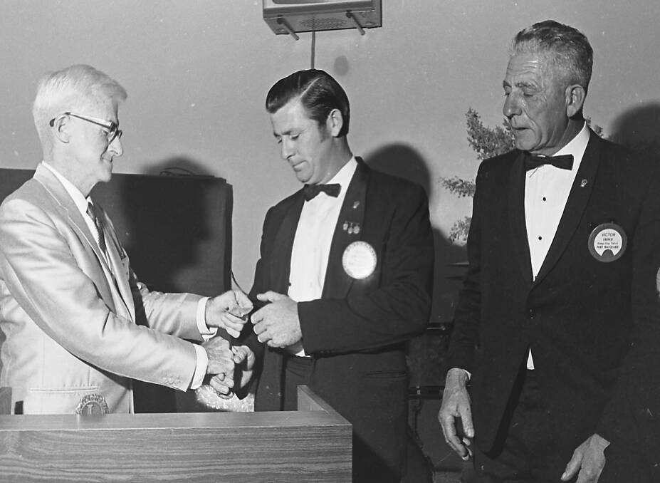 Past International Director of Lions, Mr Bill Parsons presents international awards to Brian Drewitt and Vic French, 1971.