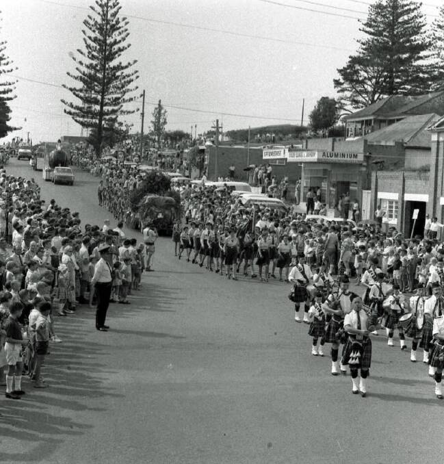 Marching to the beat: A Scottish band leads the Carnival of the Pines procession down William Street, 1968.