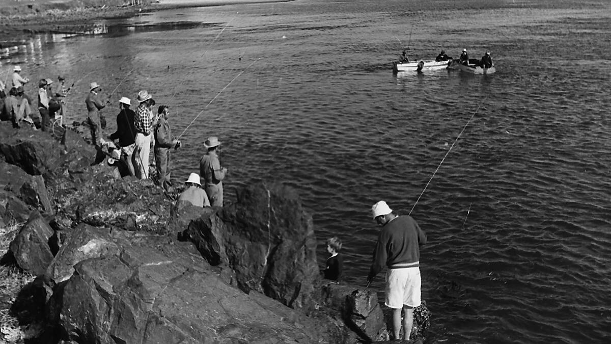Fishing from the Port Macquarie breakwall, at the entrance to Hastings River, 1971.