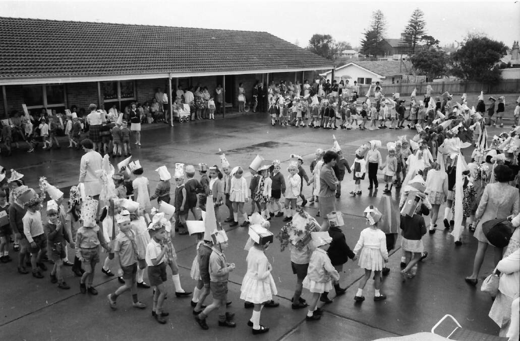 Hats on: Pupils at the Port Macquarie Infant School parade their hats as the percussion band plays.