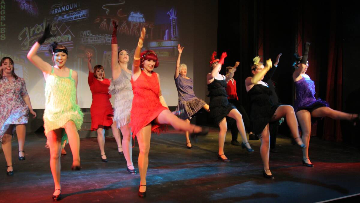 Dancing up a storm: The chorus dances energetically in The Players Theatre production of Singin' in the Rain.