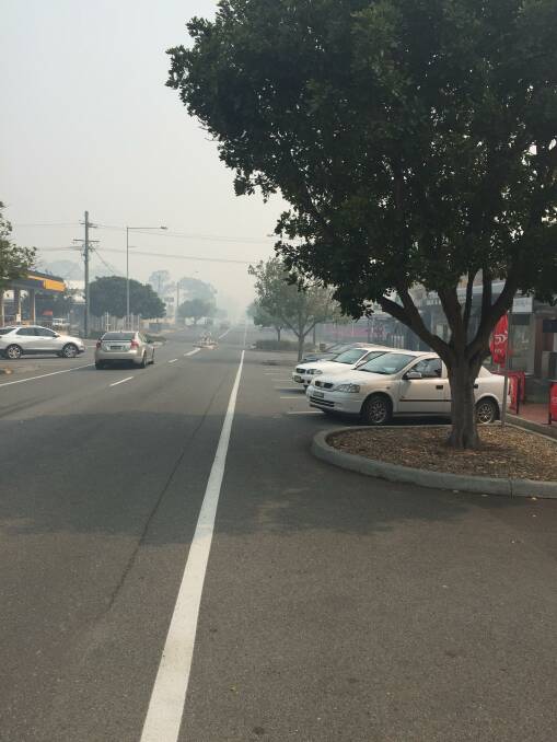 BUSHFIRE: Laurieton's main street on October 12 as RFS confirm an extreme fire danger day. 
