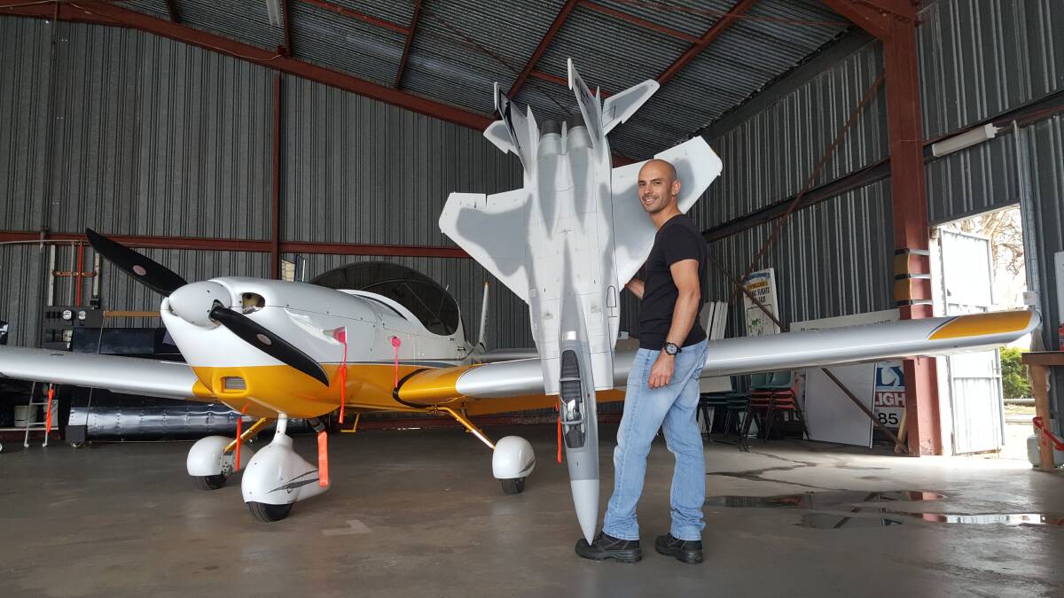FUN WITH TOYS: Doug Toppazzini with two of his planes. Photo: Laura Telford.