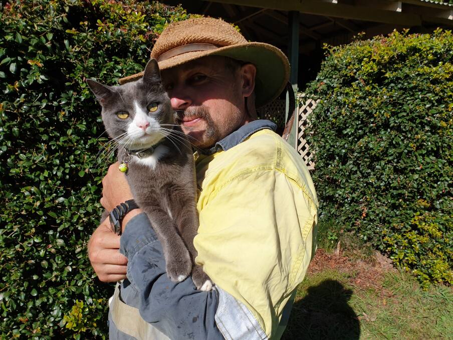 LOVE: Hastings Landcare member Steve with his beloved feline.