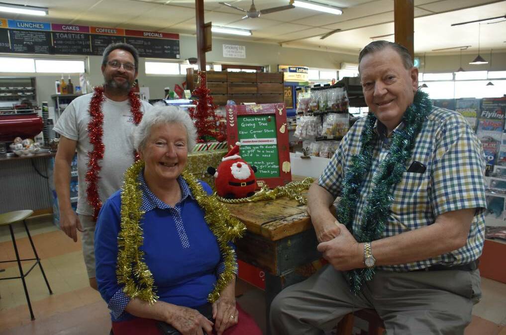 COMMUNITY: Steffan Andler, Mavis Barnes and Theo Hazelgrove at Kew Corner Store in the lead up to Christmas 2019. PHOTO: Laura Telford.