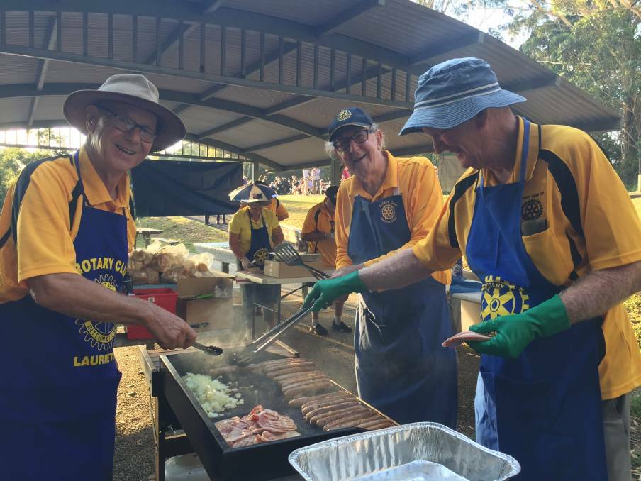 Enjoying themselves: Mike Austin, Laurie Orchard and Gordon Gray cooking up a storm at the 2019 celebration.