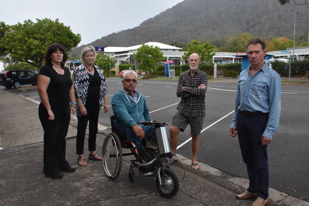 NOT HAPPY: Naomi Dowse-Collyer, Rachel Goughan, Mike Ipsen, Mike Dodkin and Harold Hunt want the proposed pedestrian crossing near Coles not the Laurieton Hotel. PHOTO: Laura Telford.