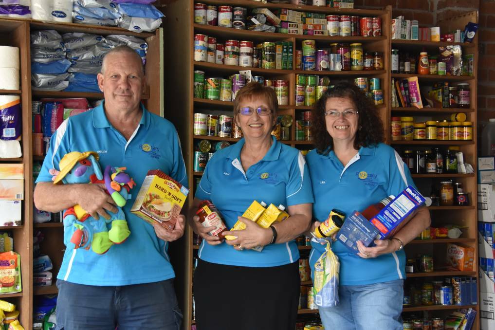 READY TO HELP: Colin Norton, Pam Foye and Lea Lloyd at the pantry in Wauchope. PHOTO: Laura Telford.