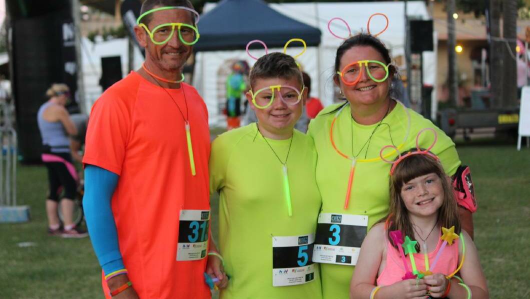 COLOUR: Nicole, Ethan and Tia Adams with Kevin Picton at the 2017 fun run.
