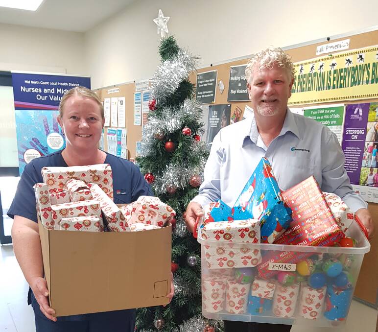 EARLY PRESENTS: Hastings Co-ops Community Engagement Manager Tim Walker presents a bundle of gifts to Kate Williams, Wauchope Urgent Care Centres Nursing Unit Manager.