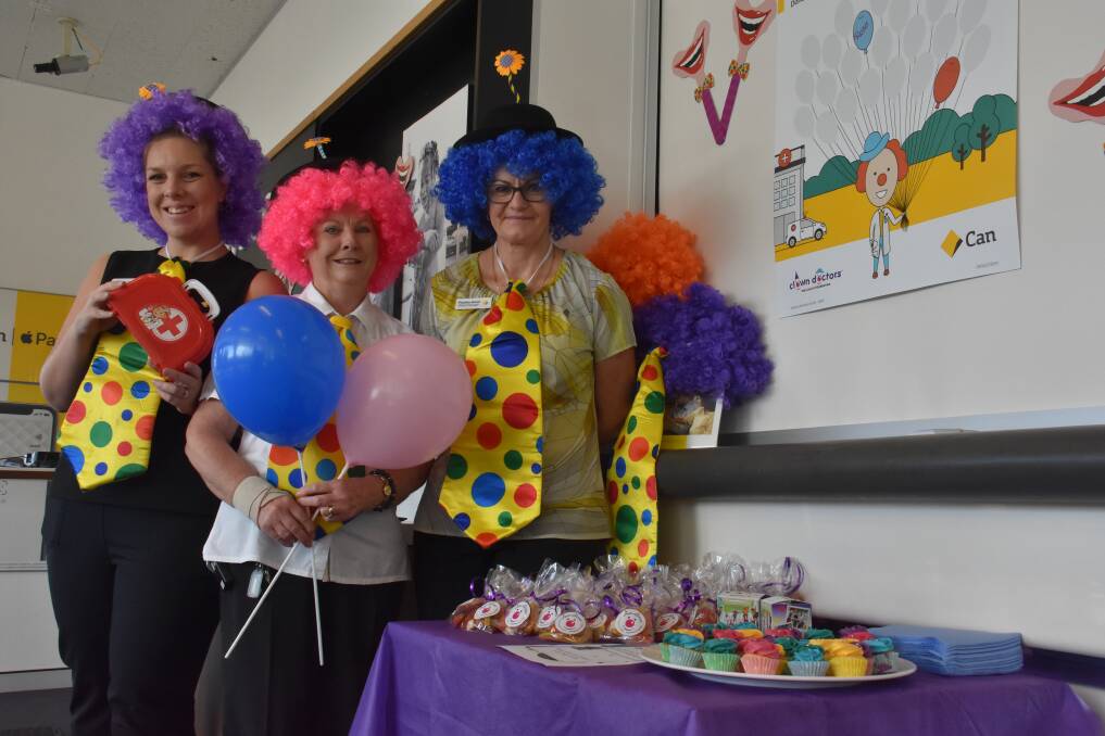 FUN: Mel Hiller, Rose Sanson and Pauline Hoad from the Commonwealth Bank in Laurieton dressed as clowns to help raise funds. PHOTO: Laura Telford.