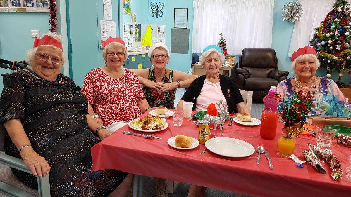 CATCH UP: Camden Haven UHA members Rachel Spurway, Margaret Murray, president Jen Lucey, Eva McMillan and May Henderson enjoy Christmas luncheon at the Camden Haven Community Health Centre.