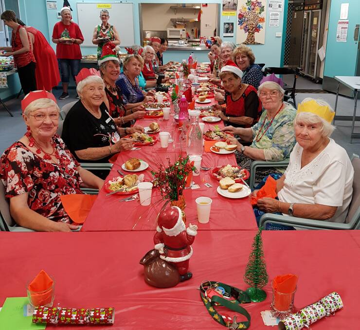 CHEERS: Members of the Camden Haven branch of the UHA enjoying their Christmas luncheon, and each others company, at Camden Haven Community Health Centre.
