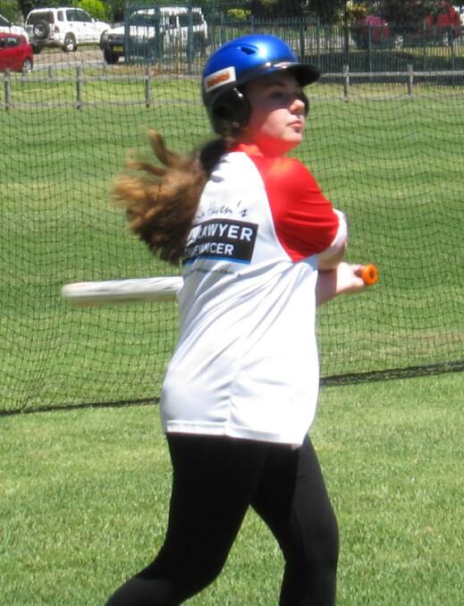 Lily Andrews hits the ball out to left field.Photo: Jo Critchley.