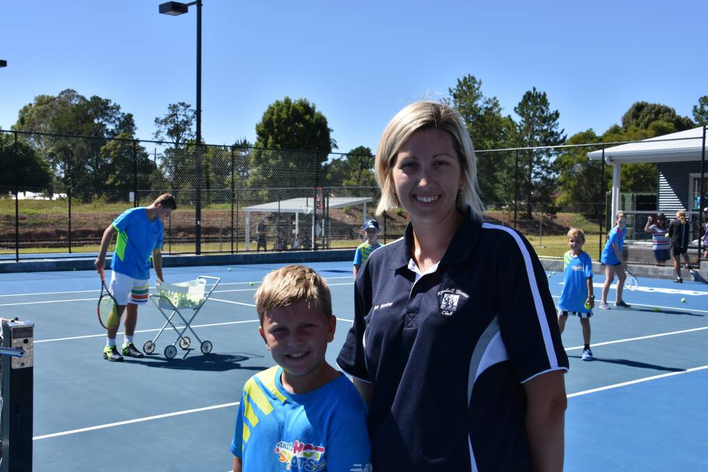 Love of the game: Deegan Wallace with his mum and Kendall Tennis Club juniors vice president Ashley Wallace. 