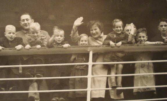 Mary Opdam waves goodbye with Henk and her children as they leave to travel to Australia. Picture: supplied. 