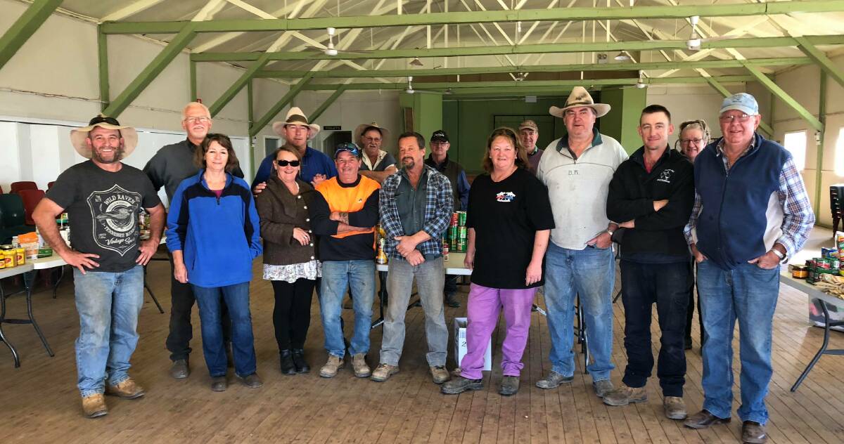 Sean Gleeson (far left) from the Camden Haven Show Society with community members from Carinda. Photo: supplied. 